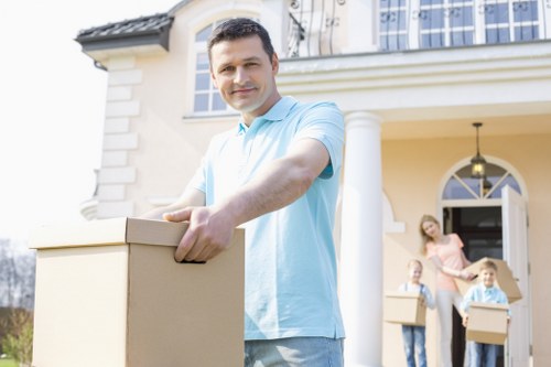 A moving team handling furniture in a Richmond upon Thames home