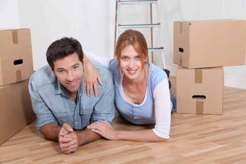 Trained movers handling boxes and furniture with care